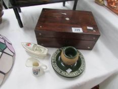 A wooden trinket box with J H Lowery glass,