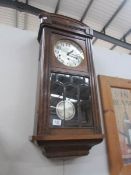 An oak wall clock.