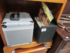 2 small cases of assorted 45 rpm records.