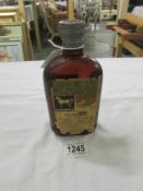 A bottle of White Horse Cellar Old Blend Scotch Whisky, bottled 1948, No.284538. (damage to label).