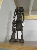 A carved wood African figure.