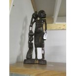 A carved wood African figure.