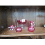 5 pieces of cranberry glass.