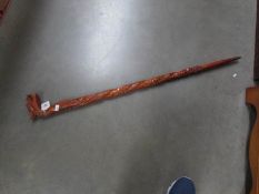 A Chinese hand carved walking stick.