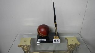 A cricket ball pen holder by Graison England and West Indies, 9th August 1988.
