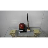 A cricket ball pen holder by Graison England and West Indies, 9th August 1988.