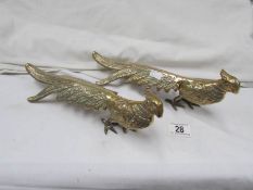A pair of brass pheasants.