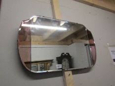 An art deco mirror with amber mirrored sides.