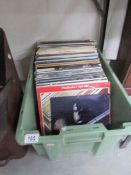 A box of approximately 100 LP records including Beatles.