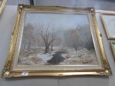 A gilt frame oil painting 'Winter Forest'.