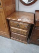 An oak 3 drawer bedside chest.