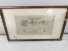 A framed and glazed Reichsbank 1000 Deutschmark note.