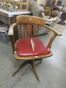 An oak captain's chair, seat a/f.