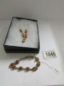 A Baltic amber and silver necklace with matching bracelet.