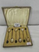 A cased set of 6 silver coffee spoons with coffee bean finials.