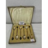 A cased set of 6 silver coffee spoons with coffee bean finials.