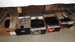 5 boxes of assorted 45 rpm records.