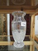 A cut glass vase with gold lettering,.