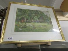 A gilt framed and glazed rural scene.