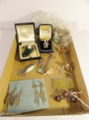 An assortment of silver jewellery including earrings, brooches, pendant on chain, ring etc.