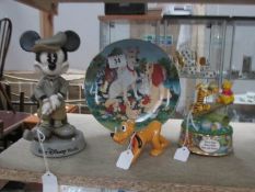 A Disney golfing Mickey Mouse, a Musical Pooh bear and Tigger, a Lady & Tramp plate and a Pluto dog,