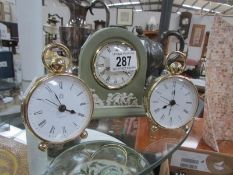 A Wedgwood clock and 2 others.