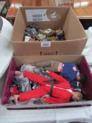 A box of play worn die cast toys and a box of action man figures.