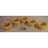 5 19th century carved ivory napkin rings.