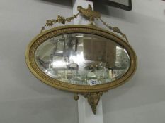 An oval Adam style mirror, frame a/f.