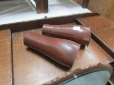 A pair of leather gaiters.