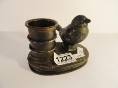 A cast iron bird pen pot.