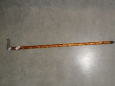 A barley twist walking stick with pewter handle in the form of a ladies leg.