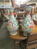 A pair of large Chinese style floor standing vases.