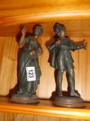 A pair of pewter figures of 18th century lady and gentleman.