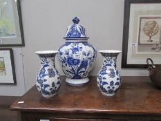 A Dutch blue and white lidded jar and a pair of Italian vases.