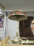 A vintage brass table lamp with shade.