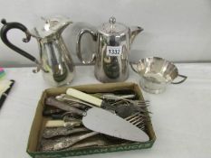 2 silver plate coffee pots, a sugar basin and a mixed lot of cutlery.