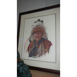 A framed and glazed tapestry of an American Indian chief.