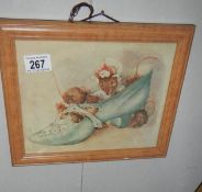 A framed and glazed study of 2 mice in a shoe.