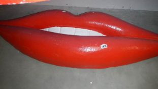 Large fibre glass fun house lips.