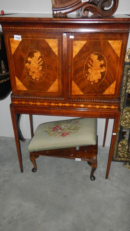 An inlaid cabinet on stand