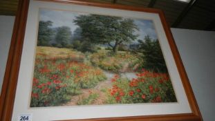 A framed and glazed pastoral scene with poppies.