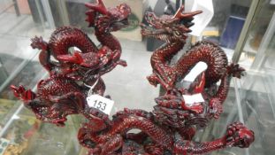 4 dragon figures,.