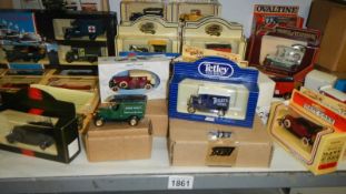 A shelf of Lledo die cast models.