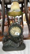 A figural lamp/clock.