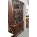 A mahogany astragal glazed book case.