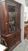 A mahogany astragal glazed book case.