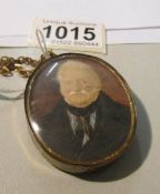A miniature watercolour portrait of an elderly gentleman mounted in a pendant.