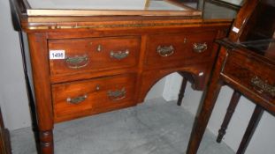 A Regency mahogany desk with brass inlay.