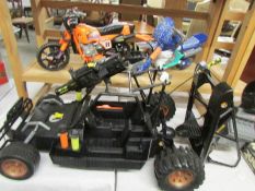 2 Action man motor cycles and a Trax vehicle.